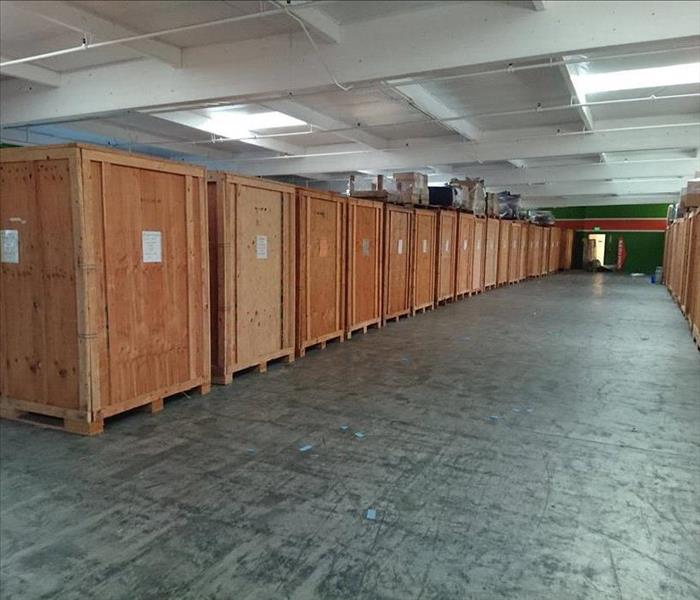 Large warehouse with wooden crates. 